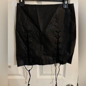 Black faux leather skirt. Size small.
